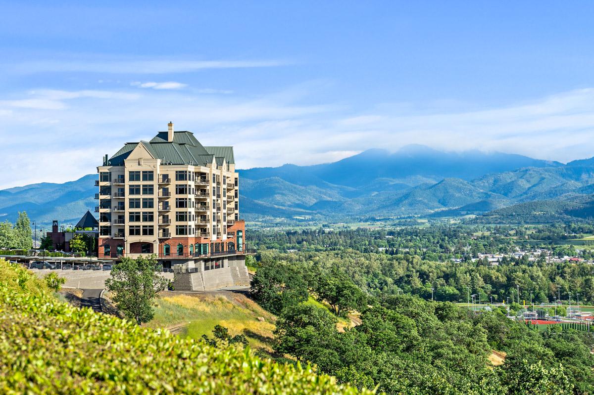 Aerial view of the Rogue Valley Manor building and surrounding hills.