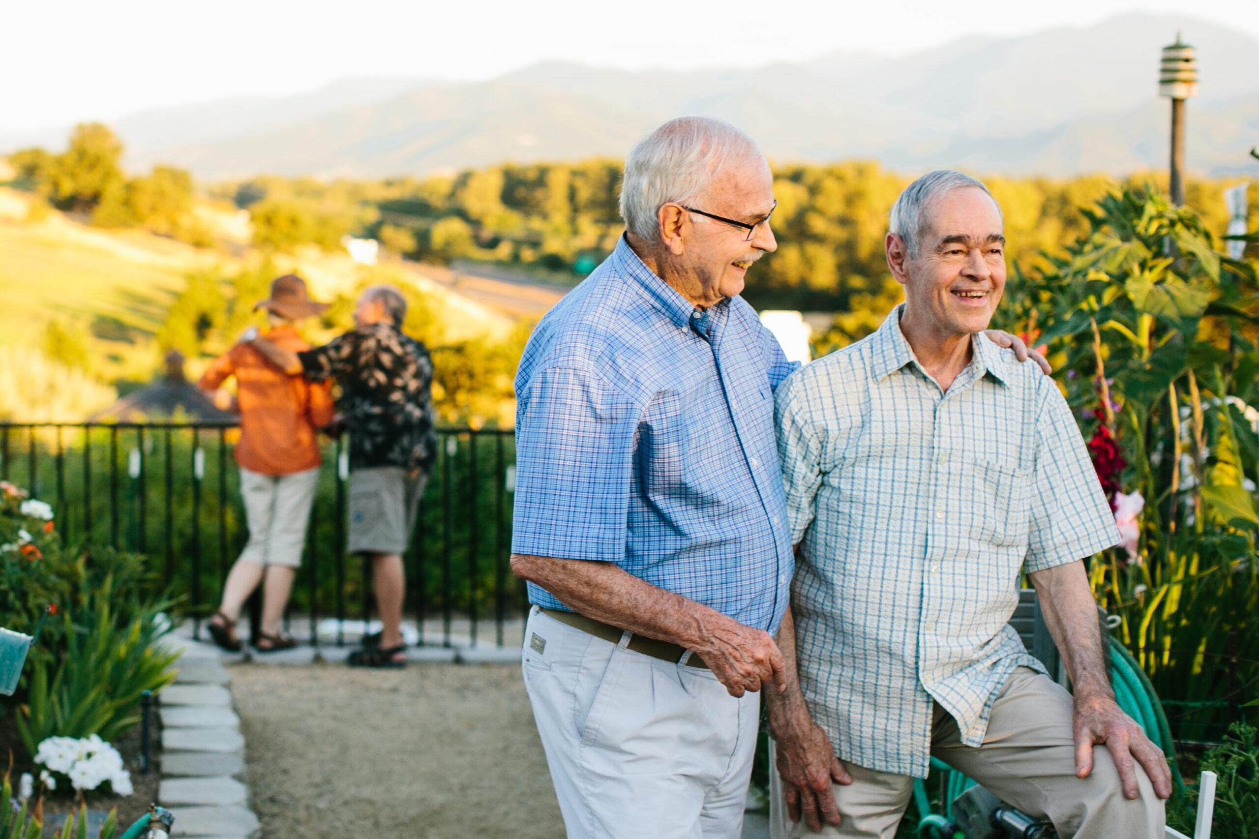 Couples enjoy a community garden at Rogue Valley Manor.