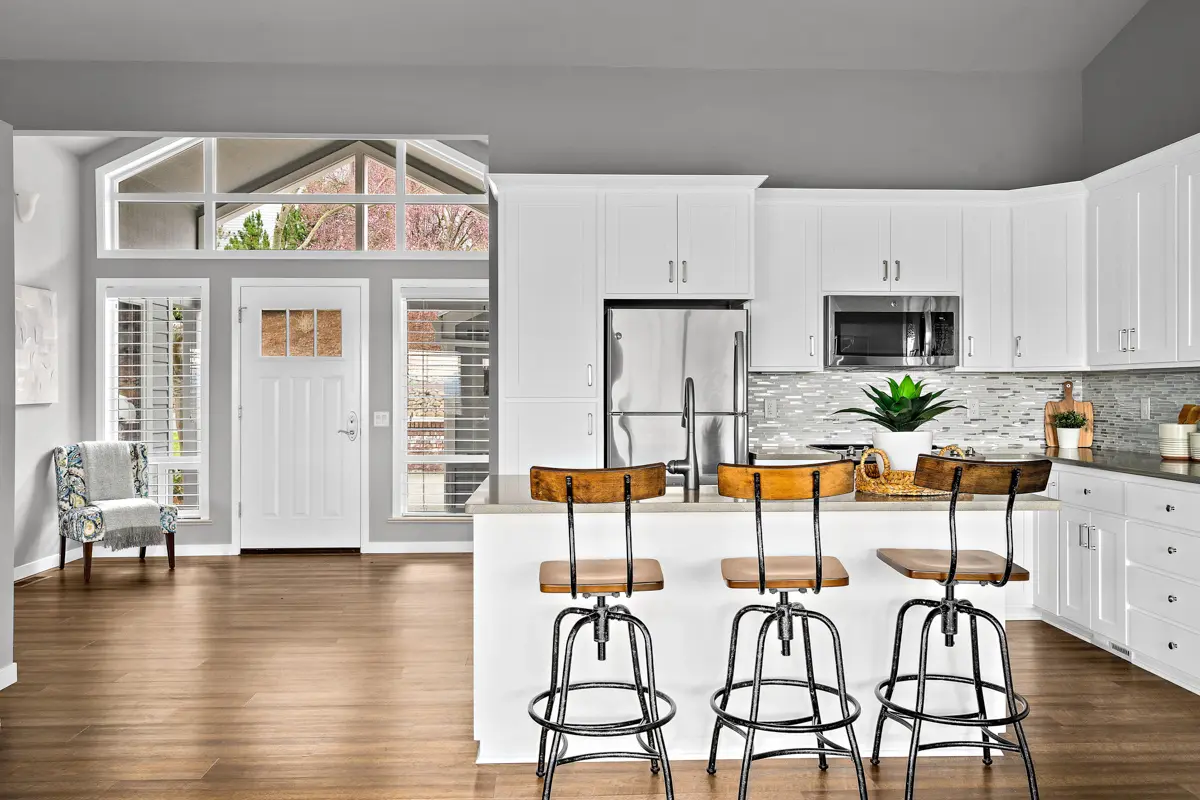 Photo of a kitchen and living space in a Rogue Valley Manor residence.