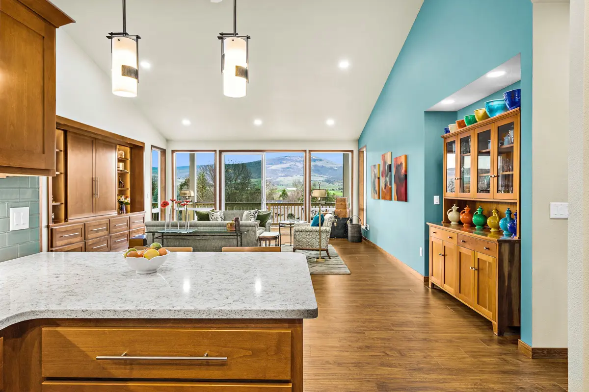 Photo of a kitchen and living room in a Rogue Valley Manor residence.