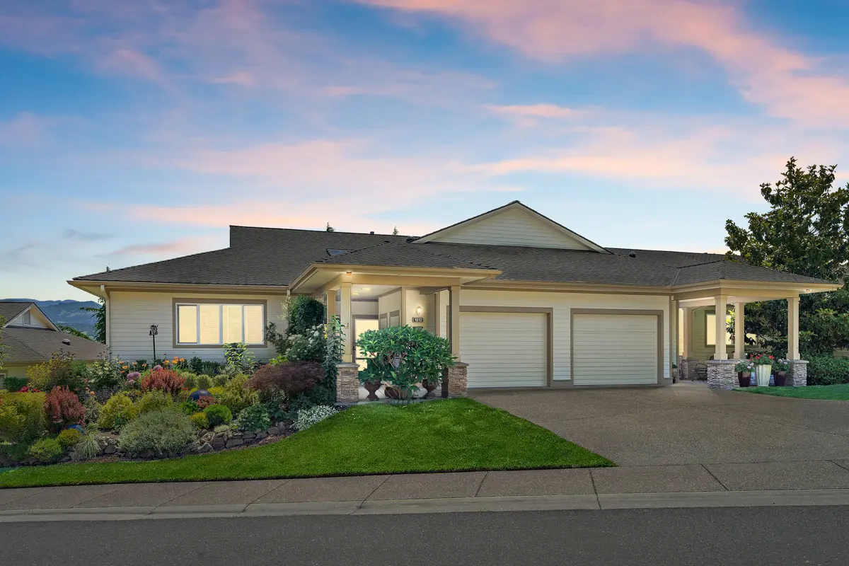 Exterior view of a Rogue Valley Manor residence at dusk.